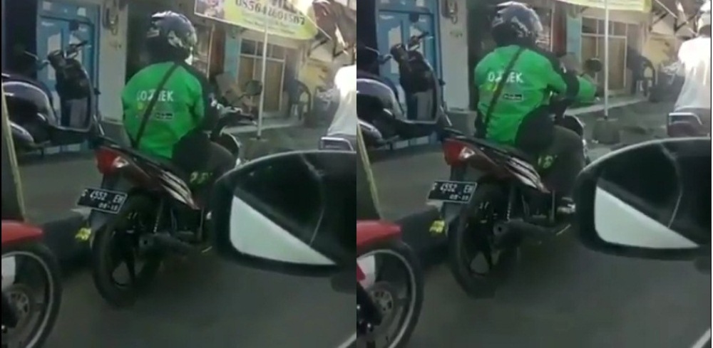 Asik Goyang di Lampu Merah Aksi Driver Ojek Online Ini Bikin Pengendara Lain Ramai Ramai Tebak Lagu yang Didengarnya