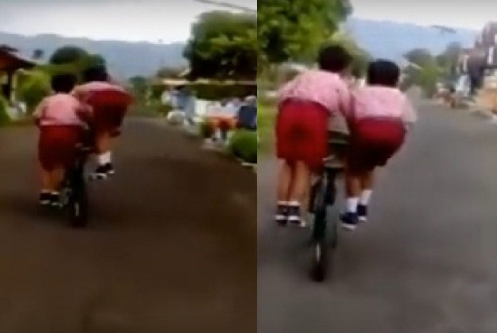 Masa Kecil Bahagia Dua Siswa SD ini Kayuh Sepeda Berdua Kompak Banget