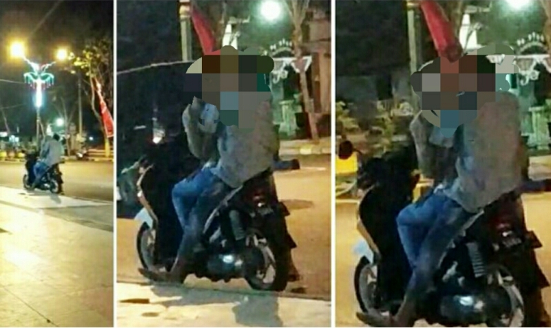 Dua Sejoli Berciuman di Taman