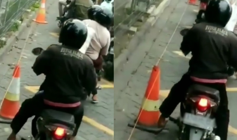 Auto Keder Pemotor Tendangi Traffic Cone di Pinggir Jalan