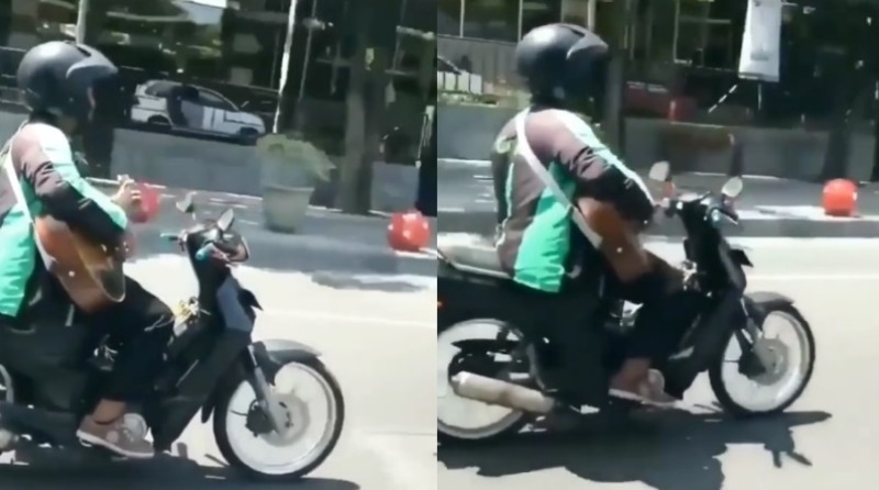 Kelakuan Nyeleneh Abang Driver Ojol Nekat Naik Motor Sambil Main Gitar