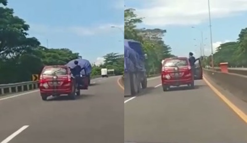 VIRAL Video Pria Santuy Banget Nyetir Mobil di Jalan Tol Sambil Berdiri