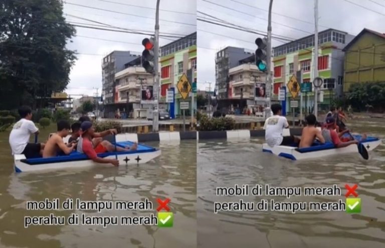 Kocak Naik Perahu di Jalanan yang Terendam Banjir Pemuda ini Tetap Berhenti Saat Lampu Merah