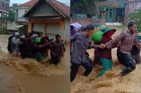 Aksi Heroik 2 Polisi Terjang Banjir Untuk Evakuasi Emak emak di Kangean Sumenep