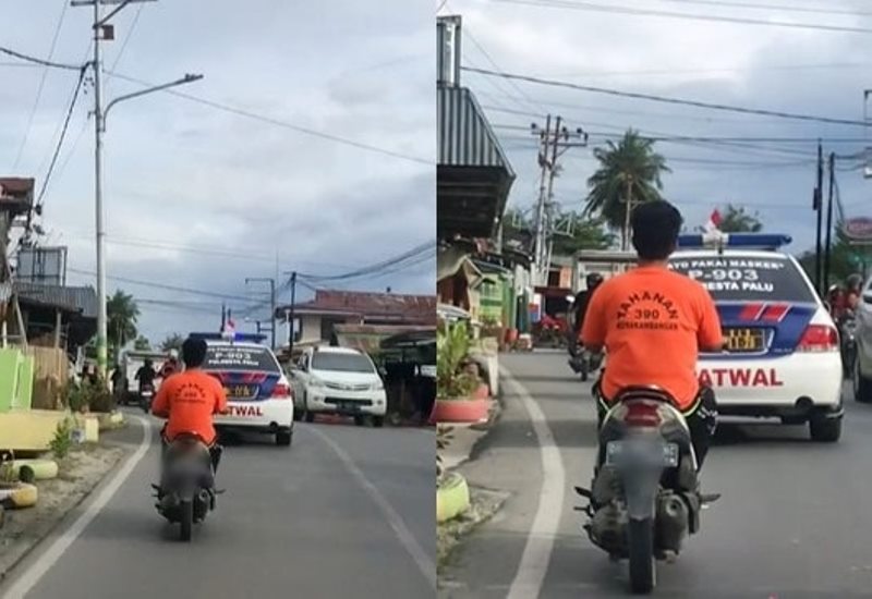 Pakai Baju Tahanan Pengendara Motor ini Santuy Melaju di Belakang Mobil Polisi