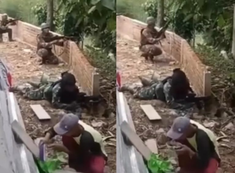 Kelewat Santuy Pria ini Tetap Tenang Makan Walau Ada Tentara Sedang Adu Tembak