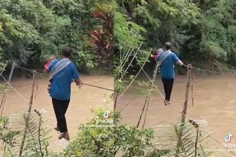Ngeri! Bapak ini Sebrangi Sungai dengan Seutas Tali Sambil Gendong Bayi